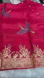 DOLA SILK SUIT IN MAJENTA COLOUR  WITH WORK ON NECK LINE AND BIRDS HIGHLTING  AND CHINNON DUPATTA  FOUR SIDE BORDER