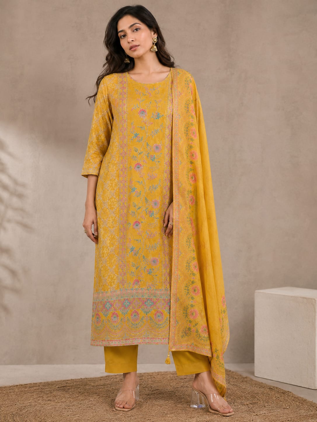YELLOW SUIT WITH HEAVY WORK ON SUIT AND HEMLINE