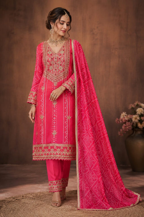 BANDANI PRINT SUIT WITH EMBROIDERY ON NECK, HEMLINE AND SLEEVES  BOTTOM WITH EMBROIDERY  BANDANI PRINT DUPATTA WITH LACE
