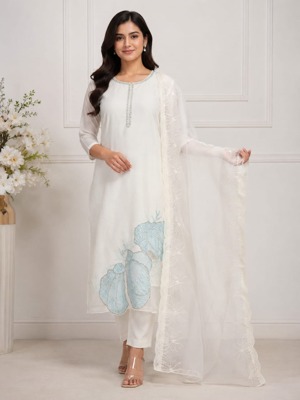 OFF WHITE COLOUR  ORGANZA  SUIT WITH BEAUTIFUL SEQUENCE  WORK NECKLINE  AND BUTTERLIES WITH SEQUENCE ON HEMLINE