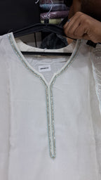 OFF WHITE COLOUR  ORGANZA  SUIT WITH BEAUTIFUL SEQUENCE  WORK NECKLINE  AND BUTTERLIES WITH SEQUENCE ON HEMLINE
