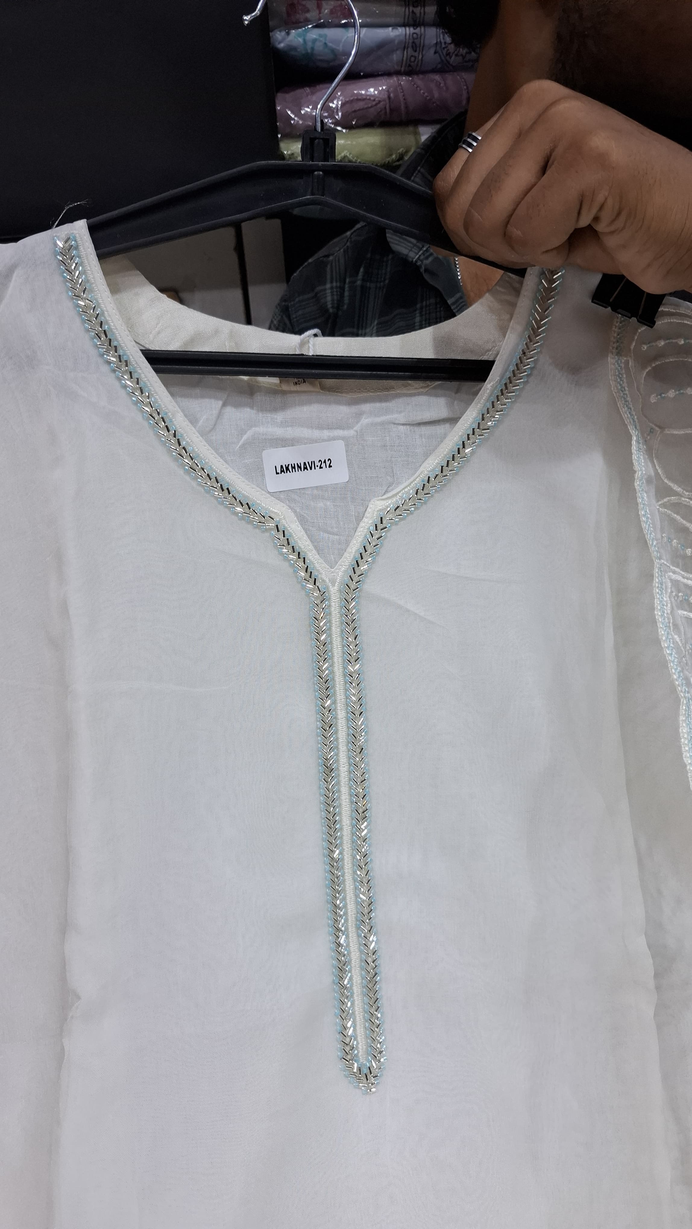 OFF WHITE COLOUR  ORGANZA  SUIT WITH BEAUTIFUL SEQUENCE  WORK NECKLINE  AND BUTTERLIES WITH SEQUENCE ON HEMLINE
