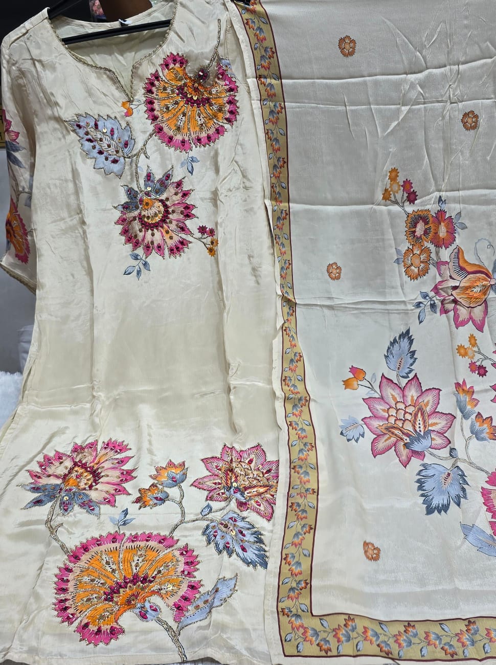 OFFWHITE  COLOUR PURE CREPE  SUIT  WITH FLORAL EMBROIDERY  WITY SEQUENCE AND MIRROR WORK