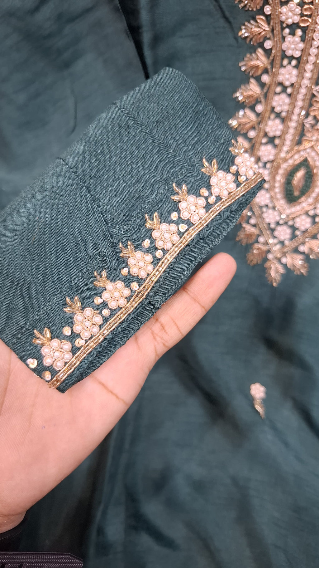 BOTTLE GREEN COLOUR DOLA SILK SUIT WITH HEAVY EMBROIDERY  OF MOTI AND DAPKA WORK ON NECK AND SMALL FLOWERS ON FULL SUIT