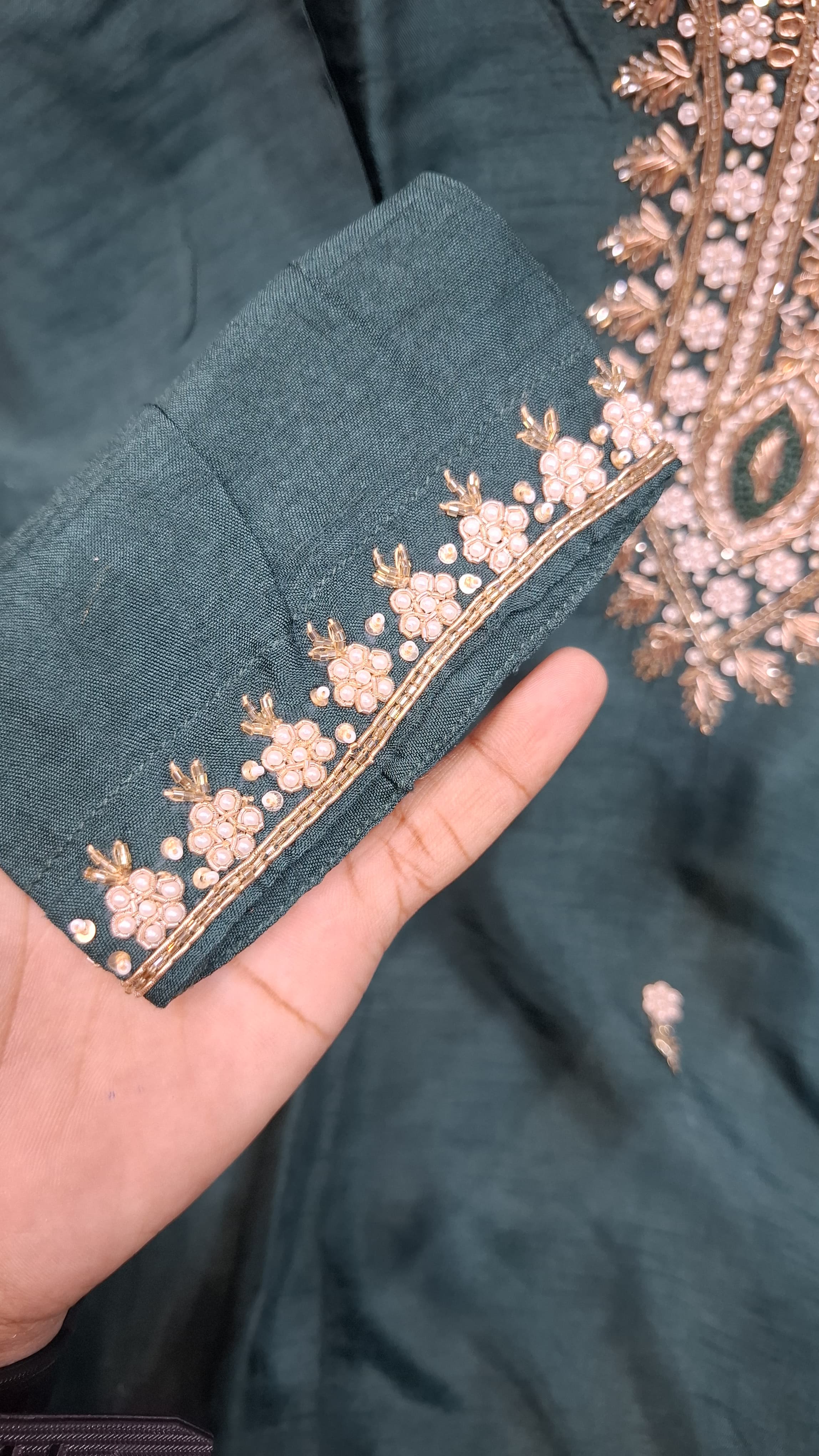 BOTTLE GREEN COLOUR DOLA SILK SUIT WITH HEAVY EMBROIDERY  OF MOTI AND DAPKA WORK ON NECK AND SMALL FLOWERS ON FULL SUIT