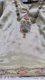 Elegant Mauve Chinnon Suit with Anquisite Moti Work